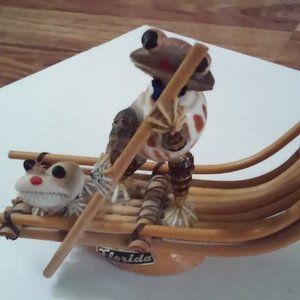 Two Frogs On A Bamboo Boat Pedaling Made With  Shells Reads 'Florida'
